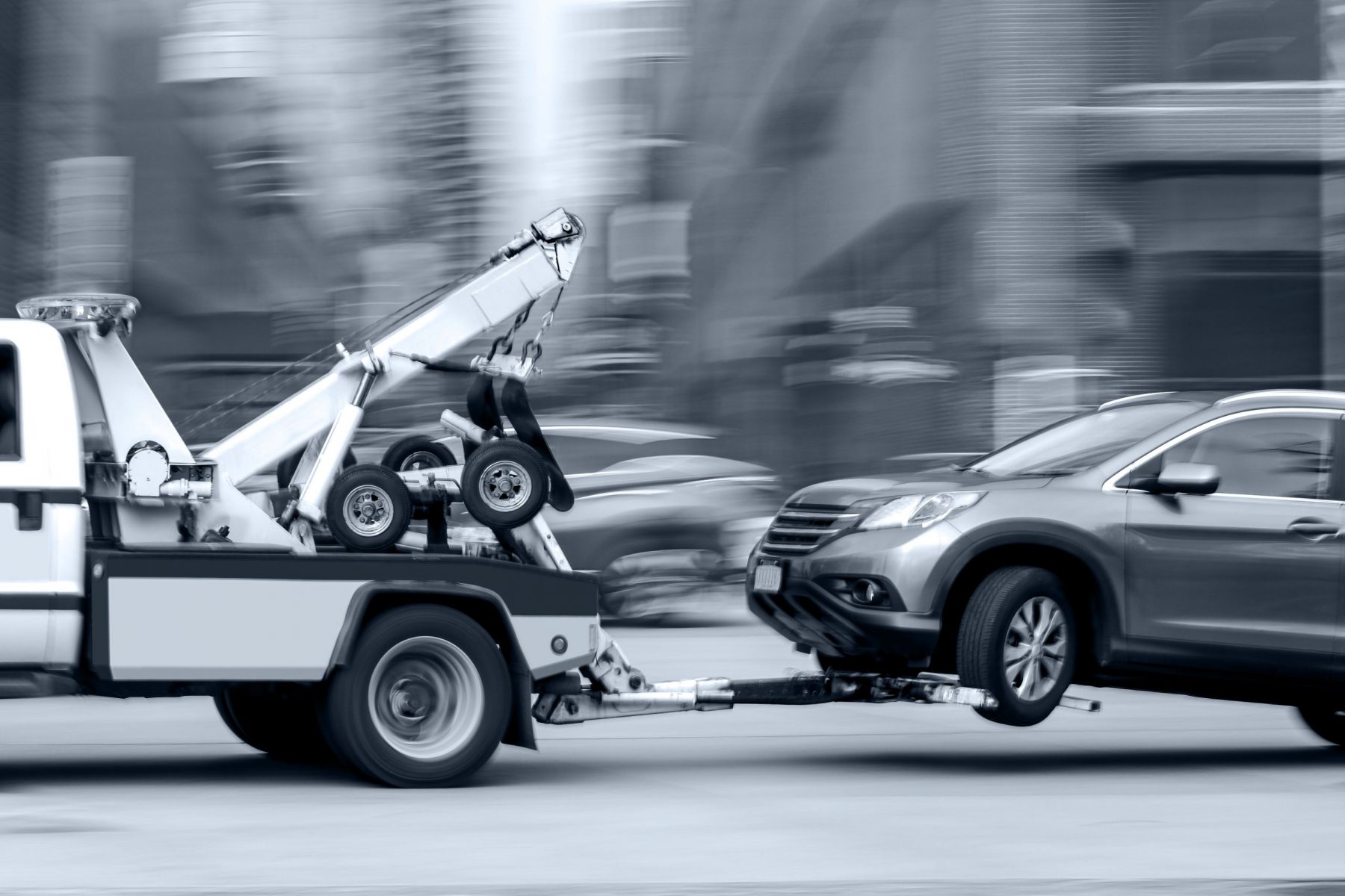 tow truck delivers the damaged vehicle